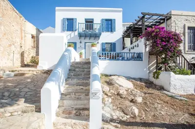 a stairway in a village with white buildings at Anteli Luxury Villa in Halki