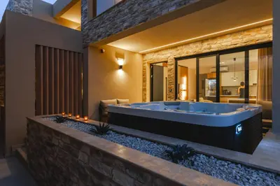 a bathroom with a large tub in a building at Aigialí Essence in Vrachonisída touArchangélou