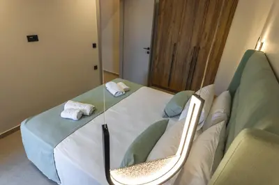 a hospital room with a bed with towels on it at Aigialí Essence in Vrachonisída touArchangélou