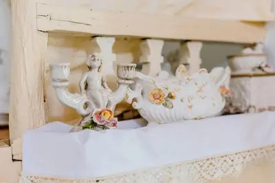 a white vase sitting on top of a shelf at Kamariko Traditional House in Afantou