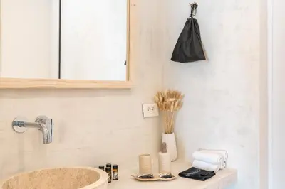 a bathroom with a sink and a mirror at Kathara bay Studios in Faliraki