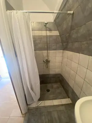 a bathroom with a shower with a shower curtain at Liora in Rhodes Town
