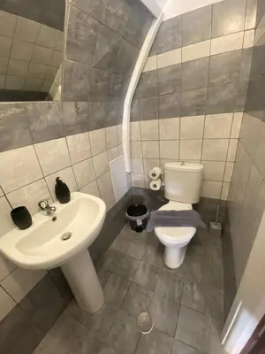 a bathroom with a toilet and a sink at Liora in Rhodes Town