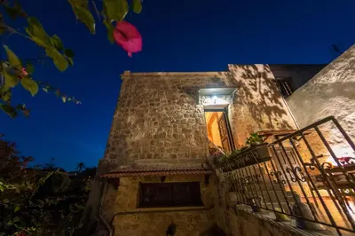 a building with a window with a light on it at Finestra Medieval Home in Rhodes Town