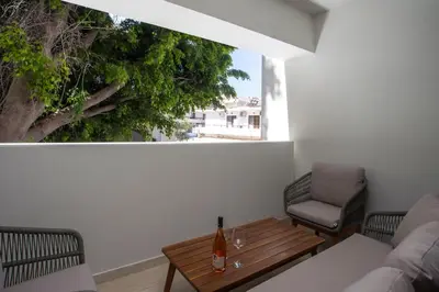 a living room with a couch and a table at Vasi Luxury Apartment in Rhodes Town