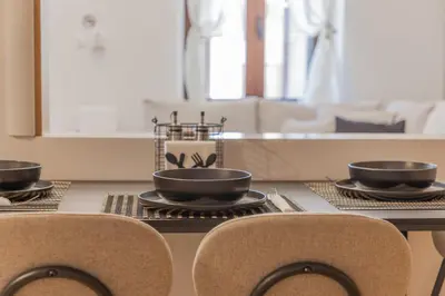 a table with three bowls on top of it at The Neo-Classic Loft in Rhodes Town