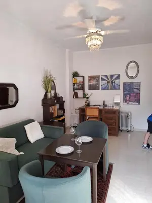 a living room with a couch and a table at Antony's Elli beach home in Rhodes Town