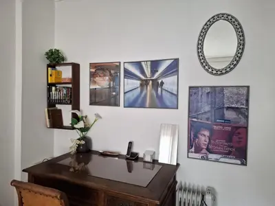 a room with a desk and pictures on the wall at Antony's Elli beach home in Rhodes Town