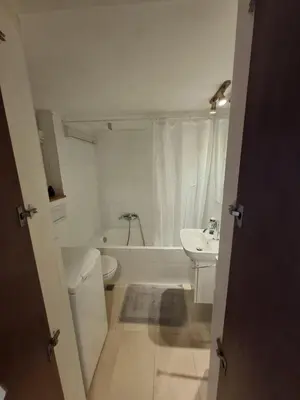 a bathroom with a toilet and a tub and a sink at Antony's Elli beach home in Rhodes Town