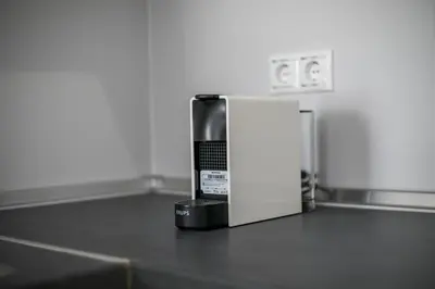 a coffee pot sitting on a counter next to a refrigerator at La Maison Antique in Rhodes Town