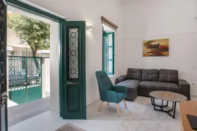 a living room with a couch and a table at La Maison Antique in Rhodes Town