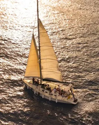 a sailboat with people on it in the water at Sailing Edisa Rhodes Adventures in Rhodes Town