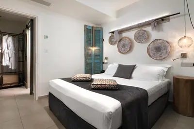 a bedroom with a large bed in a room at Elakati Luxury Boutique Hotel - Adults Only in Rhodes Town