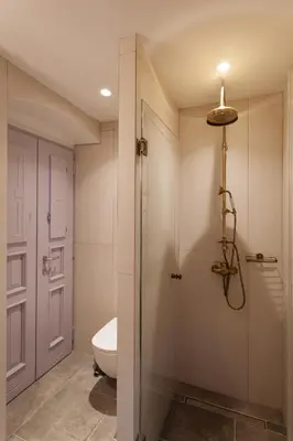 a bathroom with a shower stall and a toilet at Aylin Executive Suites in Rhodes Town
