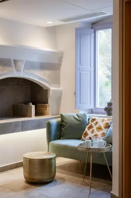 a living room with a couch and a table at Aylin Executive Suites in Rhodes Town