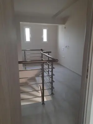 a empty room with a metal shelf in a room at Palm Marie - Rhodes in Kalithies