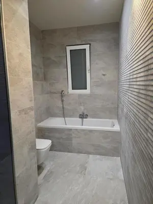 a bathroom with a tub and a toilet and a sink at Palm Marie - Rhodes in Kalithies