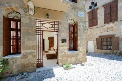 an entrance to a building with doors and windows at Kolonaki Corner in Rhodes Town