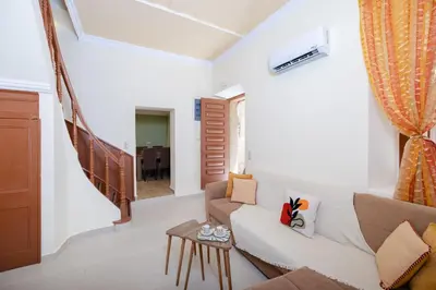 a living room with a couch and a table at Kolonaki Corner in Rhodes Town