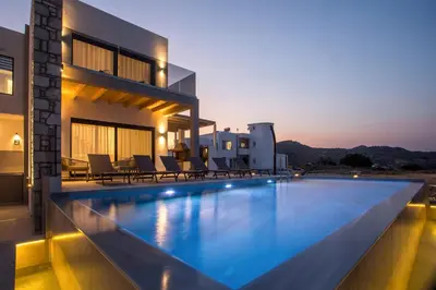 a swimming pool in the middle of a house at Blue Sunrise Villa 2 in Afantou