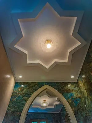 a coffered ceiling with a ceiling painting in a building at Fabrizio del Carretto in Rhodes Town