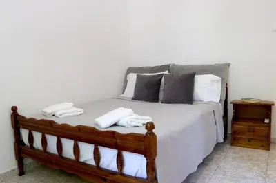 a bedroom with a bed with two towels on it at Casa Metropolis in Rhodes Town