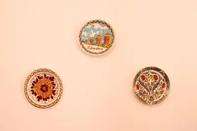 three plates hanging on a wall at Casa Metropolis in Rhodes Town