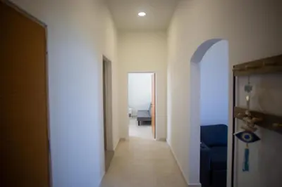 a hallway with a hallway leading to a room at Aegean Sunset Loft in Rhodes Town