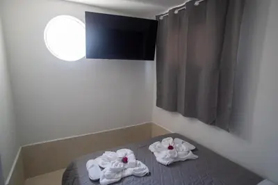a room with towels on a bed with a window at Aegean Sunset Loft in Rhodes Town