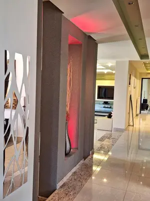 a hallway with a wall with a vase on it at Villa Maria in Haraki