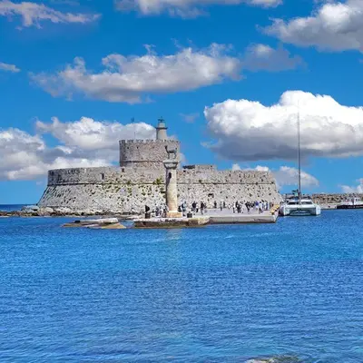 a large stone building in the middle of the water at Steno Loft Suite in Rhodes Town