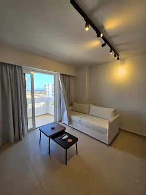 a living room with a couch and a table at AleGo Casa in Rhodes Town