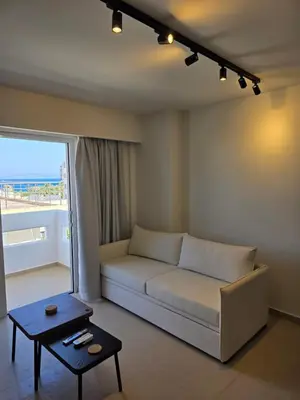 a living room with a couch and a table at AleGo Casa in Rhodes Town