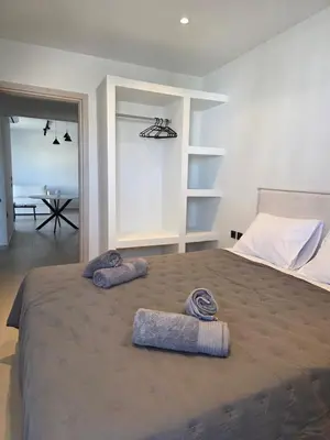 a bedroom with a large bed with two towels on it at AleGo Casa in Rhodes Town