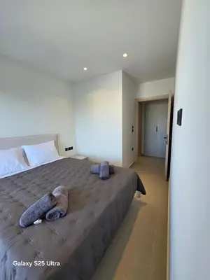 a bedroom with a bed with two stuffed animals on it at AleGo Casa in Rhodes Town