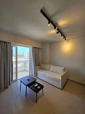 a living room with a couch and a table at AleGo Casa in Rhodes Town