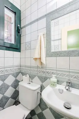 a bathroom with a toilet and a sink at Villa Angelina in Afantou