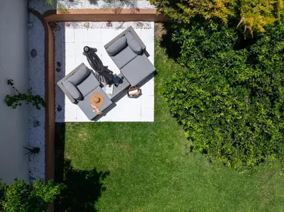an overhead view of a lawn with two cars at Duo Verde Celine Garden Apartment in Kremasti