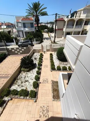 a view of a courtyard with a building at Villa Agapi in Pastida