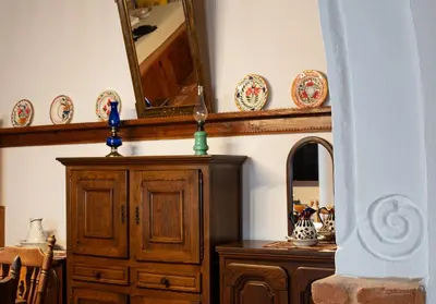 a room with a mirror and a wooden dresser at Villa Gennadi Essence in Gennadi