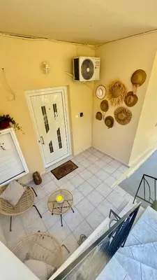 an overhead view of a living room with a table at Hidden Lemons - Boho stay in Rhodes in Rhodes Town