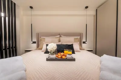 a tray of fruit sitting on top of a bed at Monte Smith Luxury Suites in Rhodes Town
