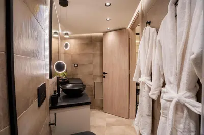 a bathroom with a sink and a mirror at Monte Smith Luxury Suites in Rhodes Town