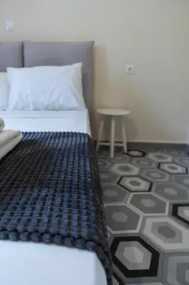 a bedroom with a bed and a table at 1944-Heritage House in Lardos