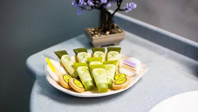 a plate of snacks on a table with a vase at LiRa in Kremasti