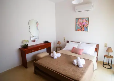 a bedroom with a bed with two stuffed animals on it at LiRa 2 in Kremasti