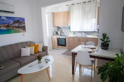 a living room with a couch and a table at LiRa 2 in Kremasti