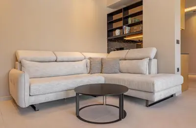a living room with a couch and a table at Costas Luxury Villas - Costa's Villa in Koskinou