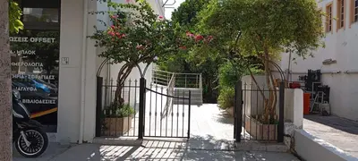 a gate to a building with pink flowers on it at Giannis Valeria in Rhodes Town