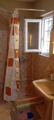 a bathroom with a shower and a sink at Giannis Valeria in Rhodes Town